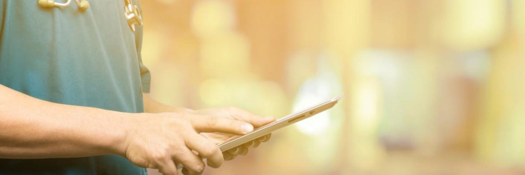 healthcare worker quickly accessing documents on a tablet on the go