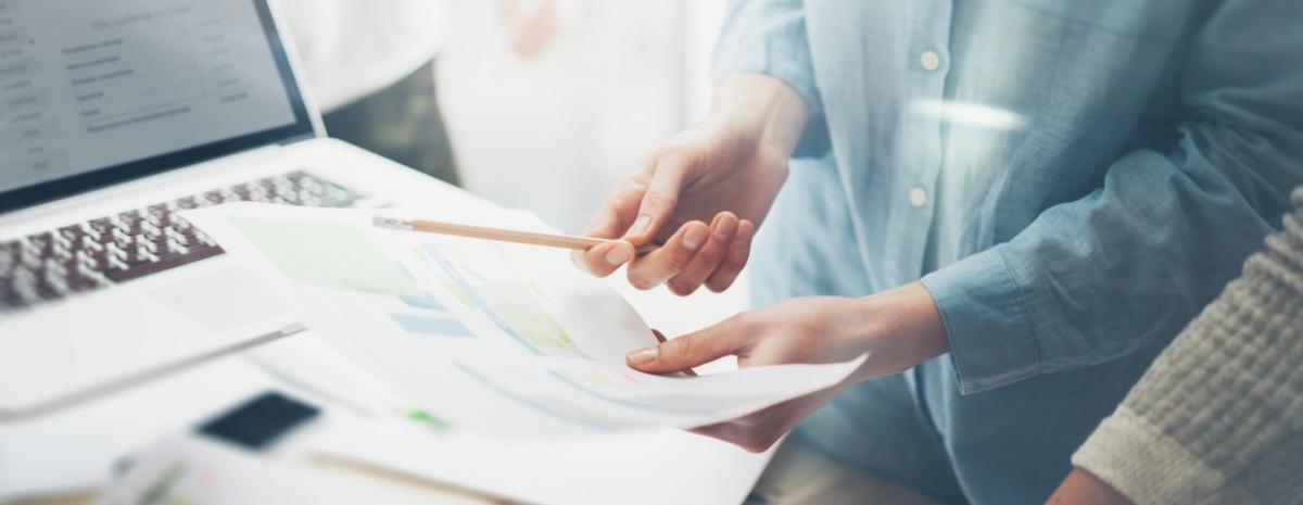 business person reviewing a paper document 