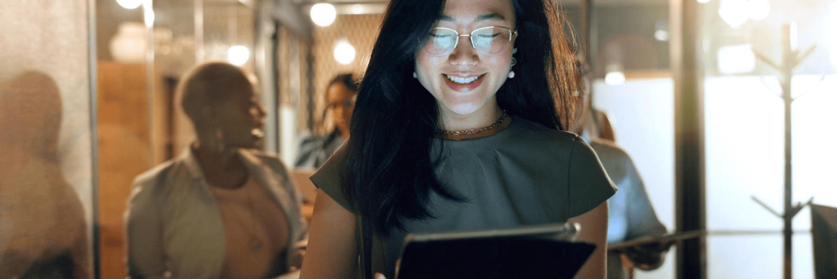 A woman on a tablet providing Proactive IT Support for Business Continuity.